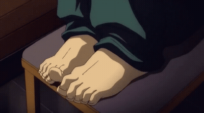 A Close Up Of A Person 'S Feet Sitting On A Stool GIF