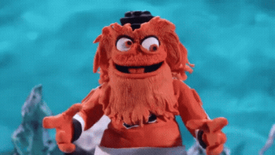 A Close Up Of A Person 'S Feet Wearing A Pair Of Black And Orange Shoes . GIF