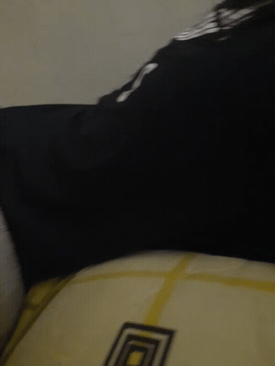 A Close Up Of A Person 'S Feet With A Black Shirt That Says ' Lg ' On It GIF