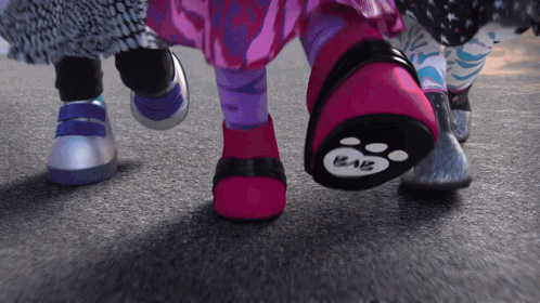 A Close Up Of A Person 'S Feet With A Paw Print That Says Kaiz On It GIF