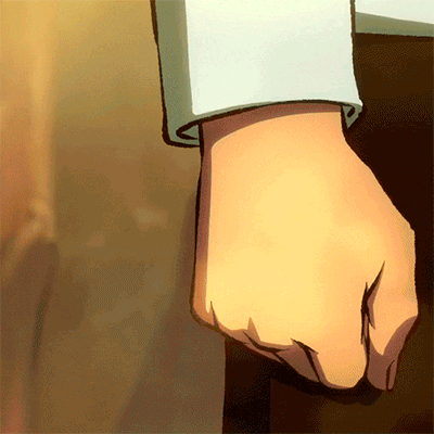 A Close Up Of A Person 'S Fist Against A Wall GIF