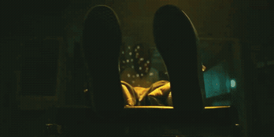 A Close Up Of A Person 'S Fist With A Yellow Light Behind It GIF