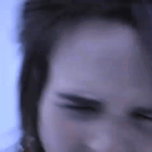 A Close Up Of A Person 'S Forehead With Their Eyes Closed GIF