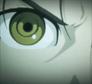 A Close Up Of A Person 'S Green Eye With A Black Pupil . GIF
