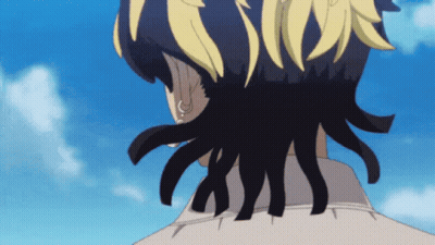 A Close Up Of A Person 'S Hair With A Blue Sky Behind Them GIF