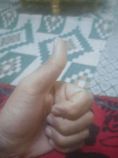 A Close Up Of A Person 'S Hand Giving The Thumbs Up GIF