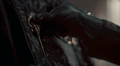 A Close Up Of A Person 'S Hand Holding A Key GIF