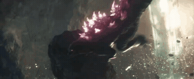A Close Up Of A Person 'S Hand Holding A Purple Object . GIF