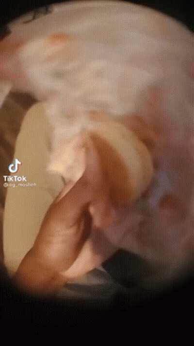 A Close Up Of A Person 'S Hand Holding A Sponge With A Tiktok Watermark On The Bottom GIF