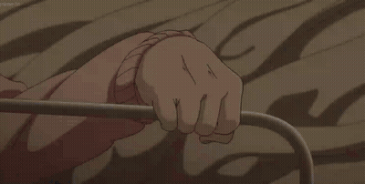 A Close Up Of A Person 'S Hand Holding Onto A Metal Railing GIF