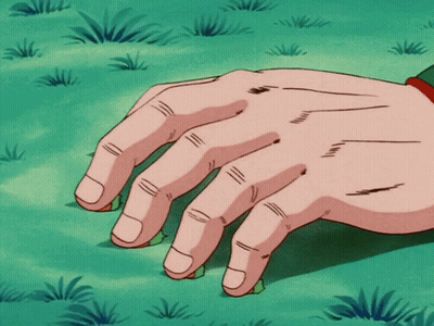A Close Up Of A Person 'S Hand On A Green Field GIF