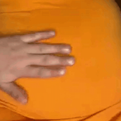A Close Up Of A Person 'S Hand On A Yellow Item . GIF