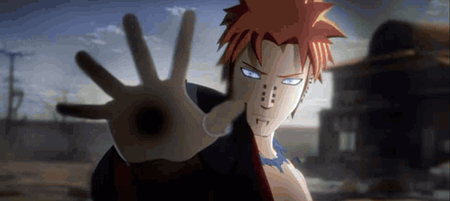 A Close Up Of A Person 'S Hand Reaching Out In Front Of A Building . GIF