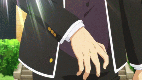 A Close Up Of A Person 'S Hand With A Black Jacket On GIF