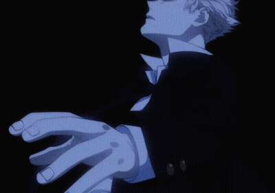 A Close Up Of A Person 'S Hand With A Black Suit GIF