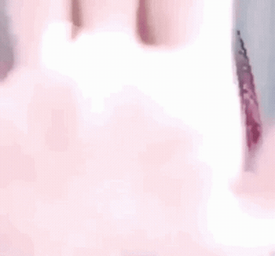 A Close Up Of A Person 'S Hand With A Blurred Background GIF