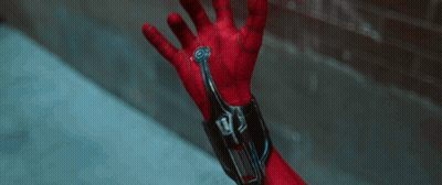 A Close Up Of A Person 'S Hand With A Device On It That Says ' Spiderman ' On It GIF