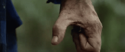 A Close Up Of A Person 'S Hand With A Dirty Thumb Pointing At Something . GIF