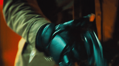 A Close Up Of A Person 'S Hand With A Glove On GIF