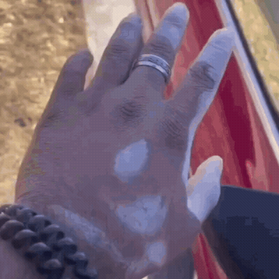A Close Up Of A Person 'S Hand With A Ring On It . GIF