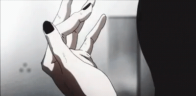A Close Up Of A Person 'S Hand With Black Nails And A Black Nail Polish . GIF