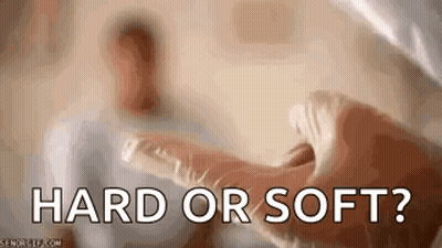 A Close Up Of A Person 'S Hand With The Words `` Hard Or Soft ? '' Written On It . GIF