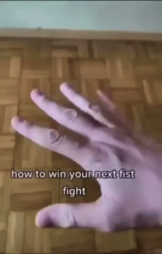 A Close Up Of A Person 'S Hand With The Words `` How To Win Your Next Fist Fight '' Written On It GIF