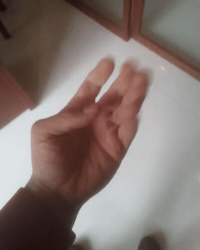 A Close Up Of A Person 'S Hand With Their Fingers Crossed GIF