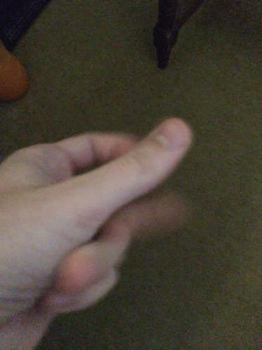 A Close Up Of A Person 'S Hand With Their Fingers Visible GIF