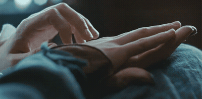 A Close Up Of A Person 'S Hands Touching Another Person 'S Hand GIF