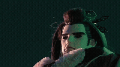 A Close Up Of A Person 'S Hands With A Purple Object Between Them GIF