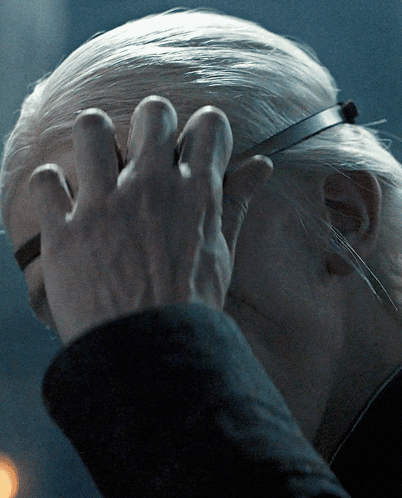 A Close Up Of A Person 'S Head With A Hand On It GIF