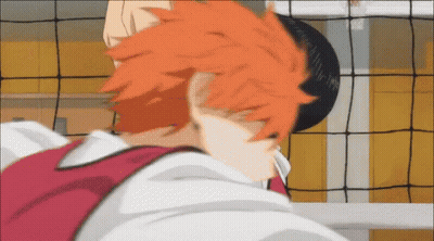 A Close Up Of A Person 'S Head With Orange Hair In Front Of A Volleyball Net GIF