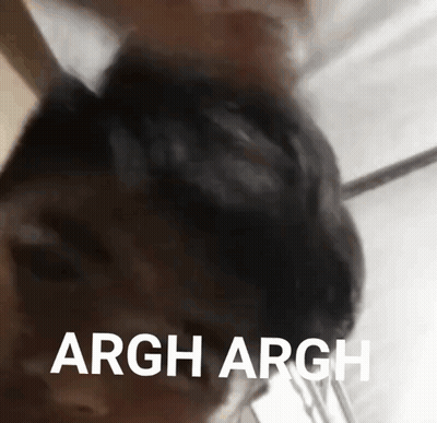 A Close Up Of A Person 'S Head With The Words Argh Argh Written In White Letters . GIF