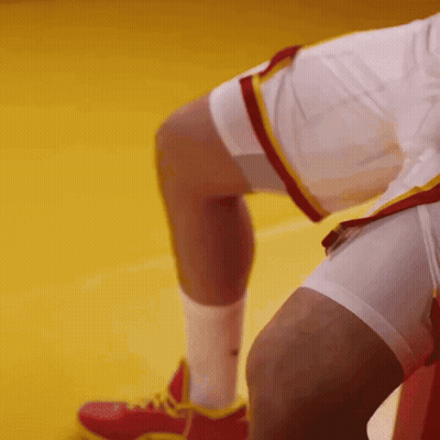 A Close Up Of A Person 'S Leg With Red Shoes GIF