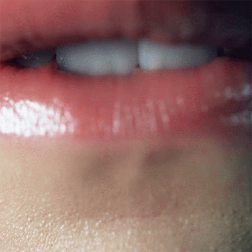 A Close Up Of A Person 'S Mouth With Red Lips GIF
