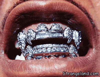 A Close Up Of A Person 'S Mouth With Strangeland.com In The Lower Right Corner GIF