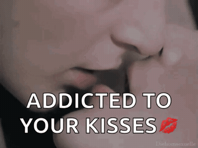 A Close Up Of A Person 'S Mouth With The Words " Addicted To Your Kisses " Below It GIF