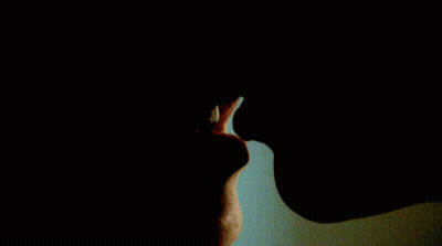 A Close Up Of A Person 'S Mouth With Their Mouth Open GIF