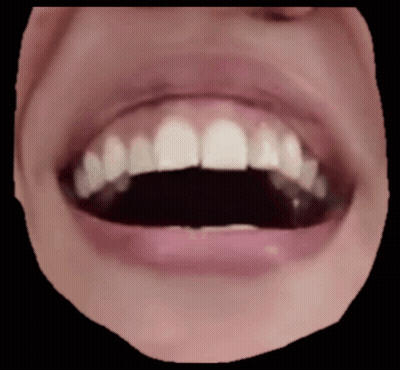 A Close Up Of A Person 'S Mouth With Their Teeth Showing GIF