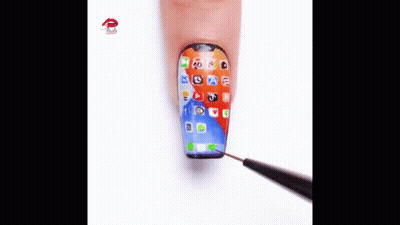 A Close Up Of A Person 'S Nails Painted To Look Like A Smart Phone . GIF
