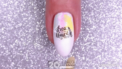 A Close Up Of A Person 'S Nails With The Words `` Dream Like A Unicorn '' Painted On Them . GIF