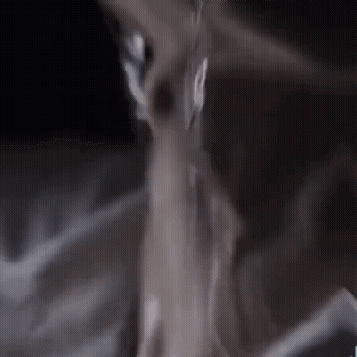 A Close Up Of A Person 'S Neck And Chest With Water Dripping From It . GIF