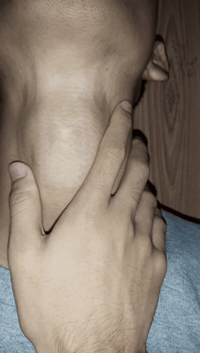 A Close Up Of A Person 'S Neck And Hand GIF