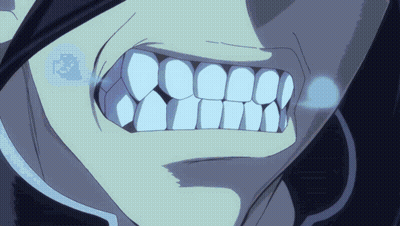 A Close Up Of A Person 'S Teeth With A Blue Light Coming Out Of It GIF