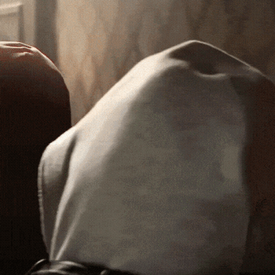 A Close Up Of A Person 'S Torso With A White Shirt On GIF