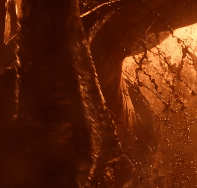 A Close Up Of A Person 'S Torso With Glowing Eyes GIF