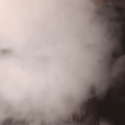 A Close Up Of A Person Smoking A Hookah With Smoke Coming Out Of It GIF