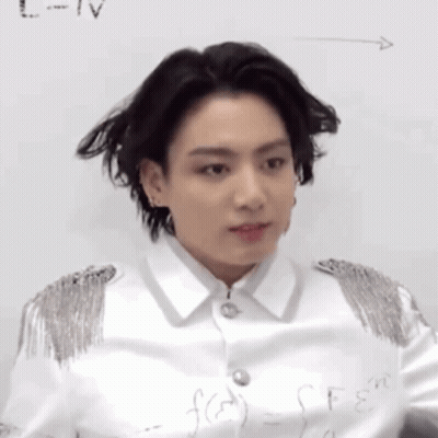 A Close Up Of A Person Standing In Front Of A White Board With A Formula Written On It . GIF