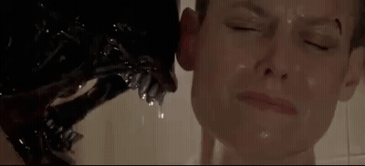 A Close Up Of A Person Taking A Bath With A Monster Coming Out Of Their Mouth . GIF